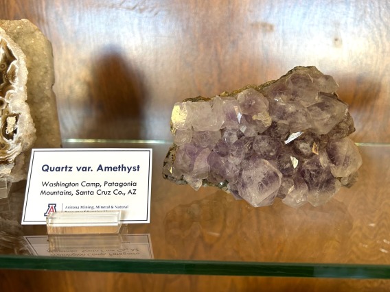 Specimen of amethyst in case.