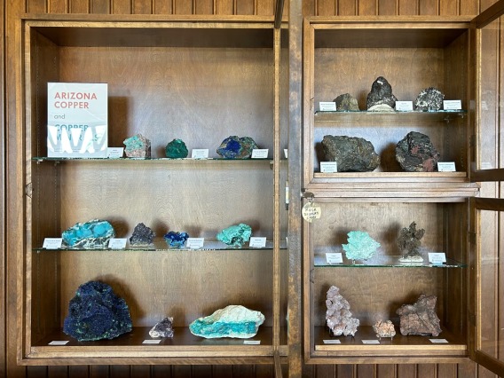 Cases of copper and copper mineral specimens.