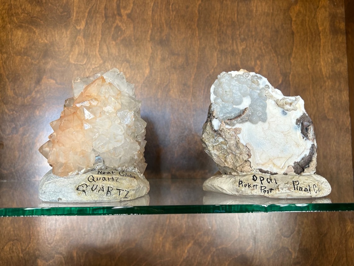 Specimens of quartz and opal in case.