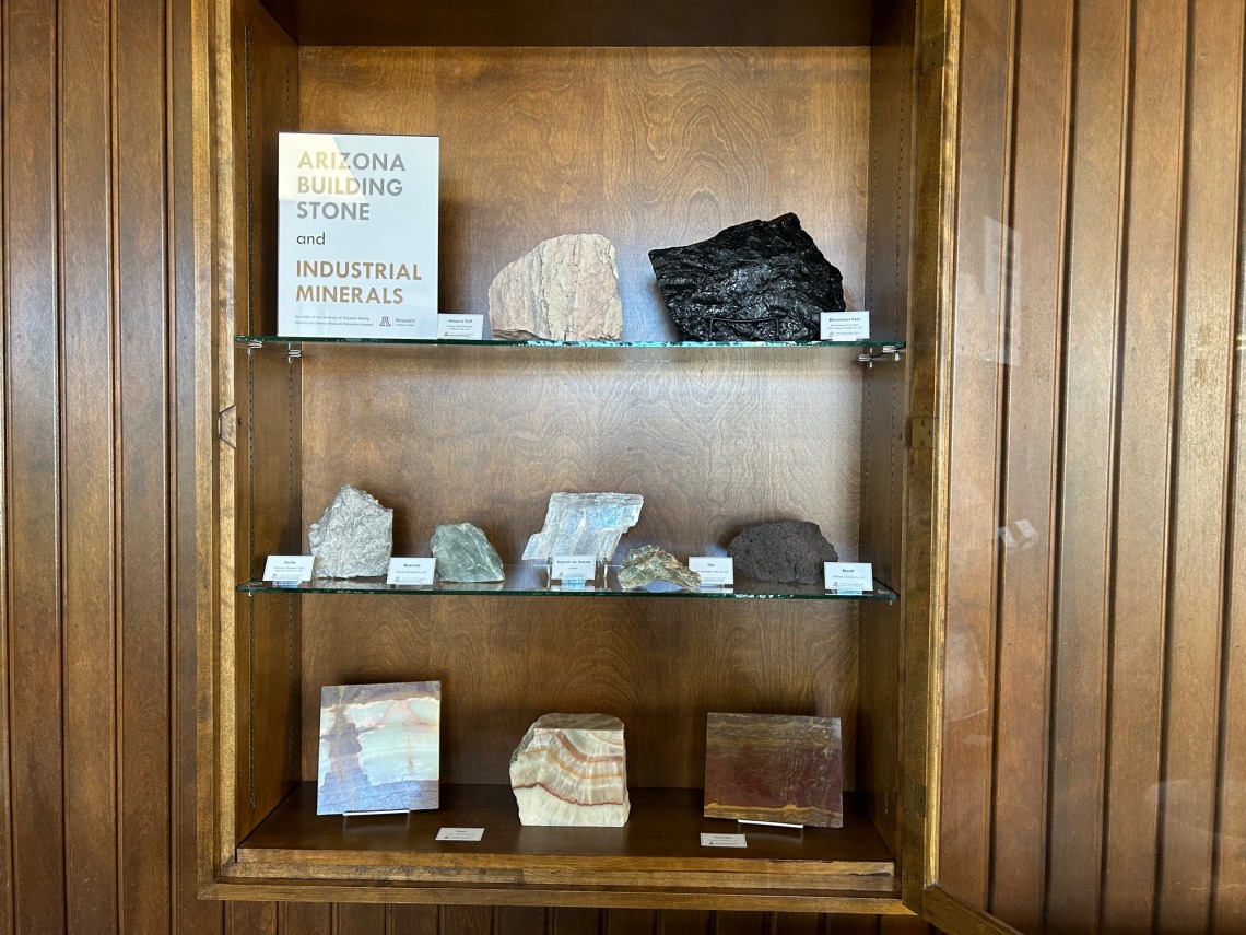 Cases of building stone and industrial mineral specimens.